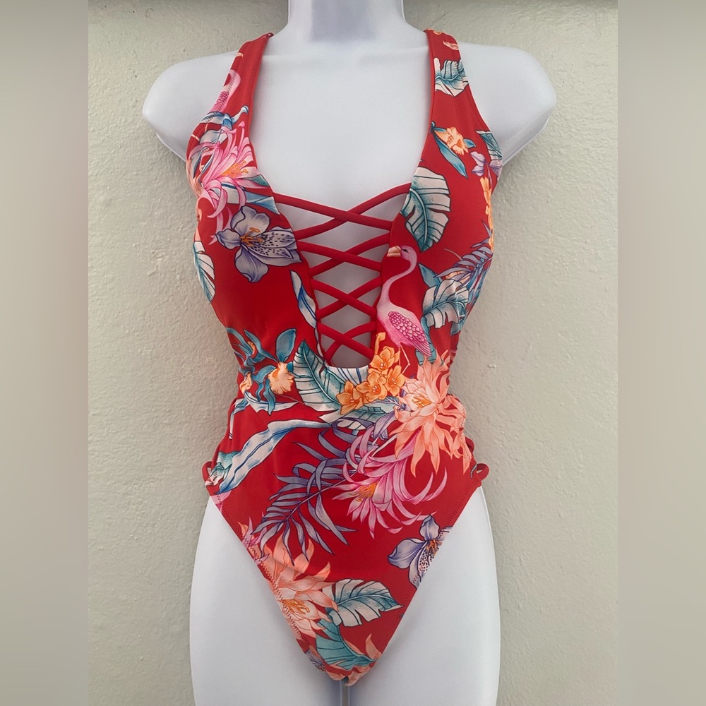 One piece bathing suit/ sides open
